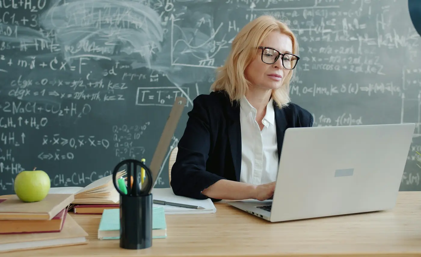 Professional online tutor teaching from a laptop